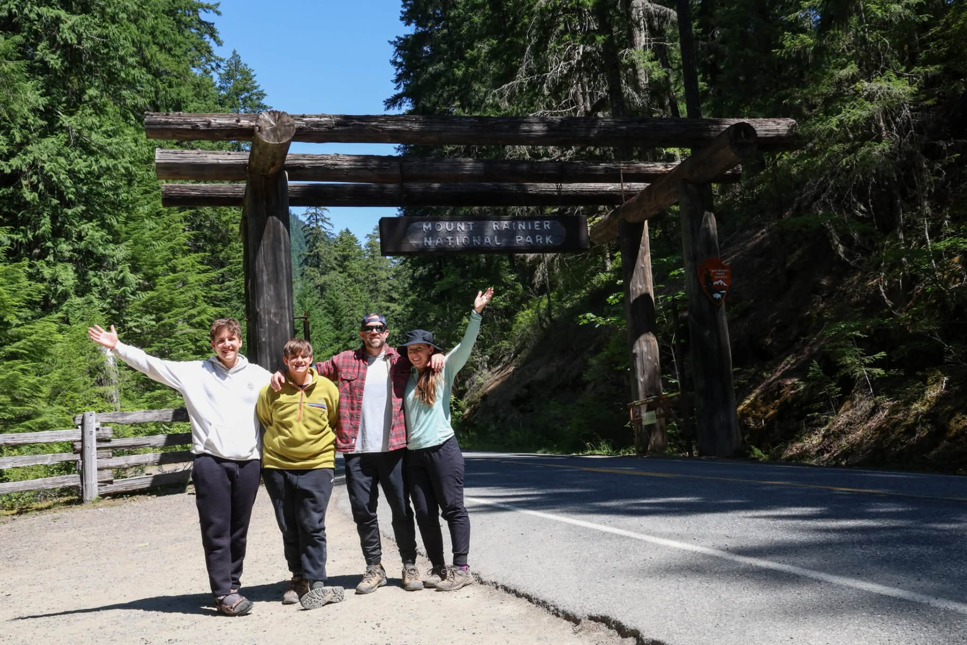 The Vaughan family at the Mount Rainier National Park entrance sign